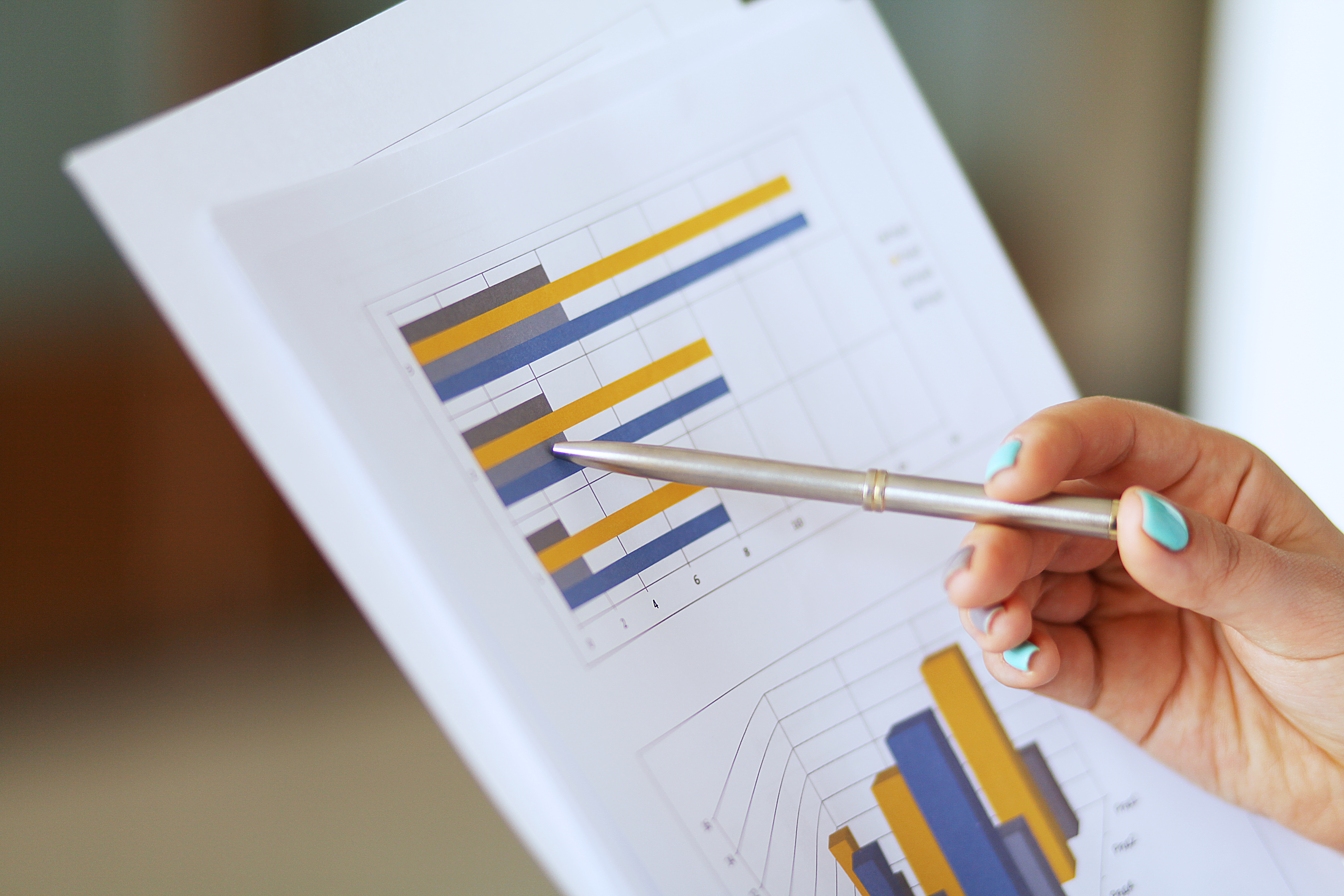 business documents with charts growth, keyboard and pen. workplace businessman